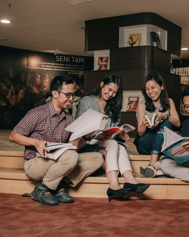 Students reading course material together